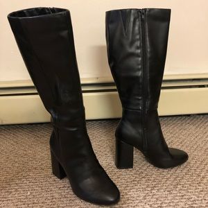 Black knee-high heeled boots